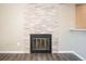 A decorative stone fireplace in a living room with hardwood floors adds warmth and character at 50 S Boulder Cir # 5022, Boulder, CO 80303