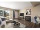 Cozy living room features fireplace with stone surround and sliding glass door to balcony at 50 S Boulder Cir # 5022, Boulder, CO 80303
