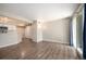 Bright living room with hardwood floors, neutral walls, and a sliding door to a balcony at 50 S Boulder Cir # 5022, Boulder, CO 80303