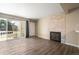 Bright living room with wood flooring, balcony access and a cozy fireplace at 50 S Boulder Cir # 5022, Boulder, CO 80303