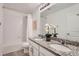 Functional bathroom with double sinks, granite countertops and a shower/tub combination at 3549 Swabuck Pl, Castle Rock, CO 80109