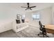 Cozy bedroom with plush carpeting, a large window, and a desk great for homework or working from home at 3549 Swabuck Pl, Castle Rock, CO 80109