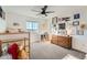 Charming bedroom with lots of natural light, ceiling fan and a view of the mountains in the distance at 3549 Swabuck Pl, Castle Rock, CO 80109