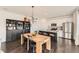 Bright open floorplan featuring a dining room with a large island and modern appliances at 3549 Swabuck Pl, Castle Rock, CO 80109