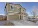 Charming two-story home boasting a covered front porch and attached two-car garage at 3549 Swabuck Pl, Castle Rock, CO 80109