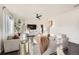 Bright living room with hardwood floors, neutral paint, stylish furniture, and abundant natural light at 3549 Swabuck Pl, Castle Rock, CO 80109