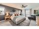 Spacious main bedroom features a dark accent wall, plush carpet and stylish furnishings at 3549 Swabuck Pl, Castle Rock, CO 80109