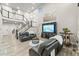 Spacious living room with a staircase, two-story ceilings, and comfortable furniture at 17880 W 94Th Dr, Arvada, CO 80007