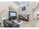 Bright living room boasts high ceilings, stylish decor, large windows, and comfortable seating at 17880 W 94Th Dr, Arvada, CO 80007