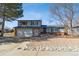 Charming two-story home features a well-kept lawn, attached garage, and inviting entrance at 11231 Clermont Dr, Thornton, CO 80233