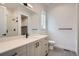 Bathroom with gray cabinets, quartz countertop and walk-in shower at 1885 Hickory Ave, Erie, CO 80516