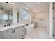 Spa-like bathroom with soaking tub and marble floors at 1885 Hickory Ave, Erie, CO 80516