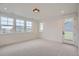 Bright bedroom with carpet and multiple windows at 1885 Hickory Ave, Erie, CO 80516