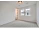 Bright bedroom with carpet and multiple windows at 1885 Hickory Ave, Erie, CO 80516