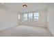Spacious bedroom with carpet, multiple windows and private access to balcony at 1885 Hickory Ave, Erie, CO 80516