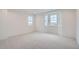 Spacious bedroom with bay window and carpeted floor at 1885 Hickory Ave, Erie, CO 80516