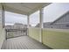 Covered deck with gray composite decking and metal railings at 1885 Hickory Ave, Erie, CO 80516