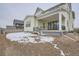 Exterior view of the back of the house with a deck and landscaping at 1885 Hickory Ave, Erie, CO 80516