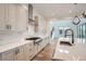 Modern kitchen with stainless steel appliances and white quartz countertops at 1885 Hickory Ave, Erie, CO 80516