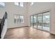 Open living space with hardwood floors and sliding glass doors at 1885 Hickory Ave, Erie, CO 80516
