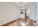 Open-concept dining area with hardwood floors and modern lighting fixtures at 4222 S Blackhawk Cir # 6G, Aurora, CO 80014