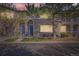 Charming townhome featuring a stone facade, blue door, covered balcony, and well-maintained landscaping at 4222 S Blackhawk Cir # 6G, Aurora, CO 80014