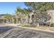 Charming townhome featuring a stone facade, arched entryway, and well-maintained landscaping at 4222 S Blackhawk Cir # 6G, Aurora, CO 80014