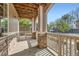 Charming front porch with stone columns, wood ceiling, and an inviting atmosphere at 4222 S Blackhawk Cir # 6G, Aurora, CO 80014