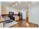 Well-lit kitchen features stainless steel appliances, light wood cabinets, and a double sink at 4222 S Blackhawk Cir # 6G, Aurora, CO 80014