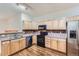 Bright kitchen with stainless steel appliances and warm wood flooring, a culinary dream at 4222 S Blackhawk Cir # 6G, Aurora, CO 80014