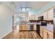 Open concept kitchen showcasing stainless steel appliances and seamless flow to the dining area at 4222 S Blackhawk Cir # 6G, Aurora, CO 80014