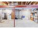 Spacious unfinished basement, offering ample storage and potential for customization at 7700 Bison Ct, Littleton, CO 80125