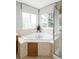 Spacious bathroom with a luxurious corner tub, tile surround, and separate shower at 7700 Bison Ct, Littleton, CO 80125
