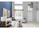 Welcoming living area featuring soaring ceilings, plenty of natural light, and comfortable seating at 7700 Bison Ct, Littleton, CO 80125