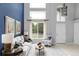 Inviting living room featuring soaring ceilings, large windows, and stylish furnishings at 7700 Bison Ct, Littleton, CO 80125