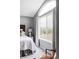 Serene main bedroom with window and a comfortable chair at 7700 Bison Ct, Littleton, CO 80125