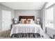 Serene main bedroom with cozy bed and natural light at 7700 Bison Ct, Littleton, CO 80125