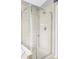 Tiled shower stall with glass door and chrome fixtures at 7700 Bison Ct, Littleton, CO 80125
