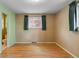 Bedroom with hardwood floors and vintage wallpaper accents at 6960 S Penrose Ct, Centennial, CO 80122