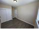 A neutral bedroom featuring a closet with sliding doors, and bright natural light at 12036 Monaco St, Brighton, CO 80602