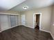 A bright bedroom featuring a built-in closet with a shelving system and access to an ensuite bathroom at 12036 Monaco St, Brighton, CO 80602