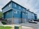 Exterior view of townhome community with attached garages and neat landscaping at 12036 Monaco St, Brighton, CO 80602