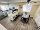 Bright eat-in kitchen features granite countertops, stainless steel appliances, and a dining table at 12036 Monaco St, Brighton, CO 80602
