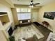 Open-concept living room boasts a fireplace, plush seating, and ample natural light at 12036 Monaco St, Brighton, CO 80602