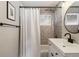 Bathroom features a sink with modern fixtures and subway tile on the shower walls at 1040 Florence St, Aurora, CO 80010