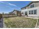 Spacious backyard featuring a seating area, lush green grass, and a secure fence, perfect for outdoor enjoyment at 9466 Quintero St, Commerce City, CO 80022
