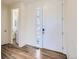 Inviting entryway with wood-look flooring and a decorative stained-glass sidelight at 9466 Quintero St, Commerce City, CO 80022