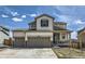 Charming two-story home with a three-car garage and a welcoming front porch at 9466 Quintero St, Commerce City, CO 80022