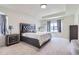 Spacious main bedroom featuring a tray ceiling and ample natural light at 9466 Quintero St, Commerce City, CO 80022