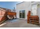 Outdoor patio area perfect for relaxation with seating and a wooden fence for privacy at 1315 Estes St # 13C, Denver, CO 80215